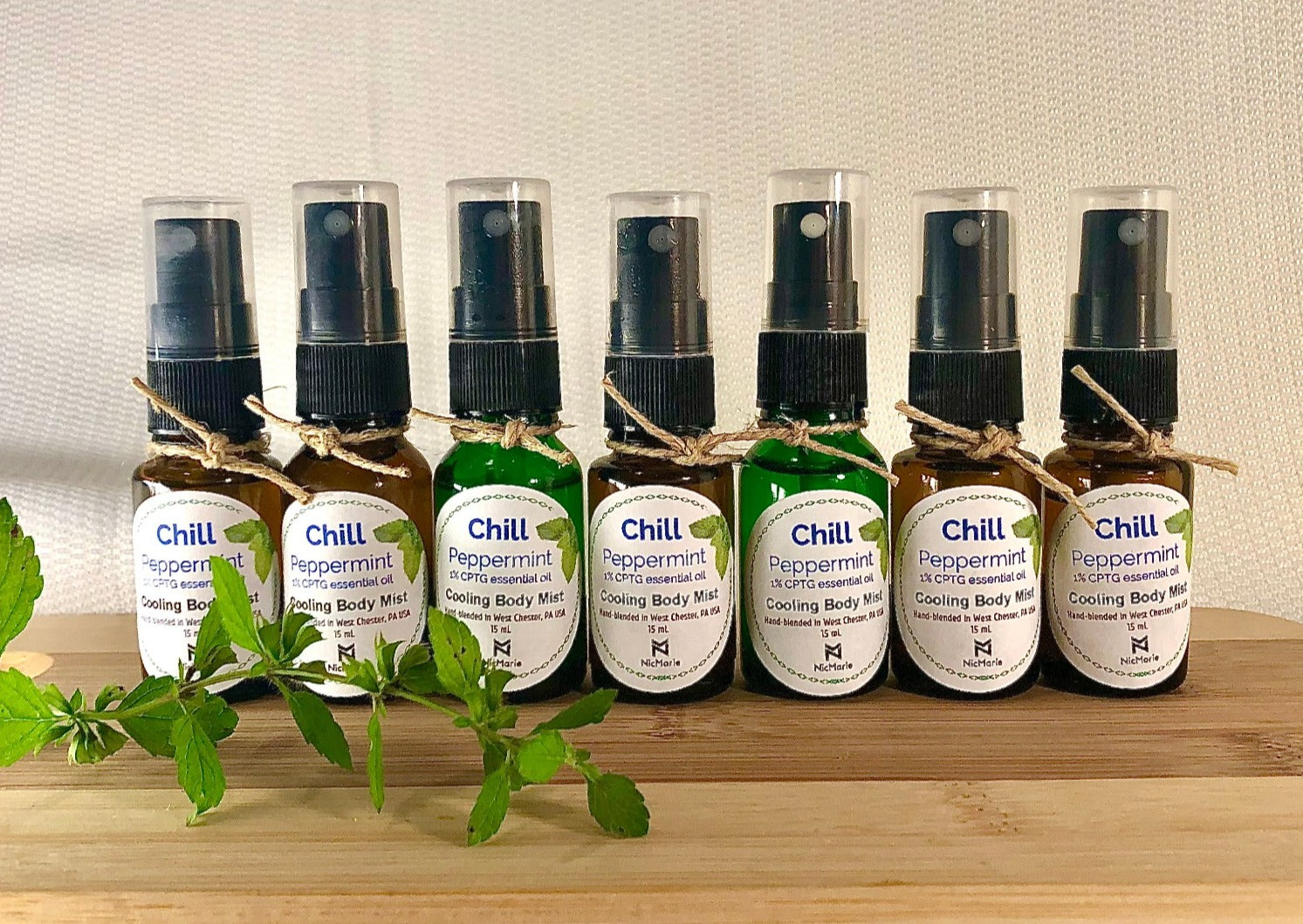 6 bottles lined up of peppermint cooling mist by nicmarie